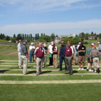 People standing at a field day.