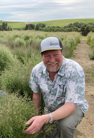 Michael Neff standing in turfgrass plots.