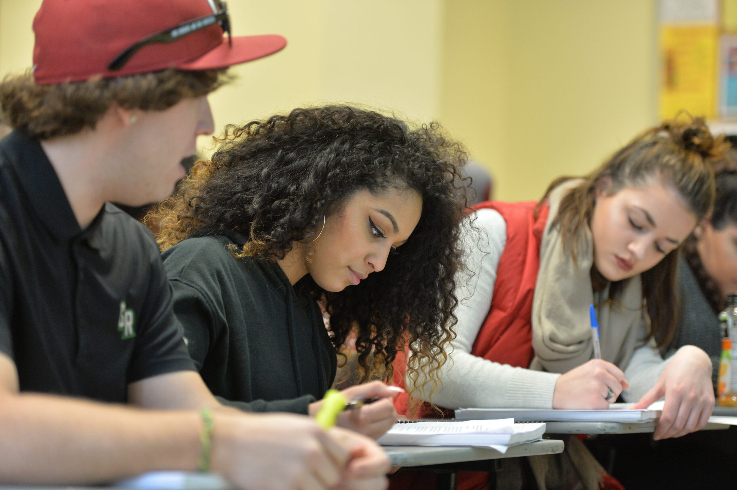 WSU students in a classroom studying.