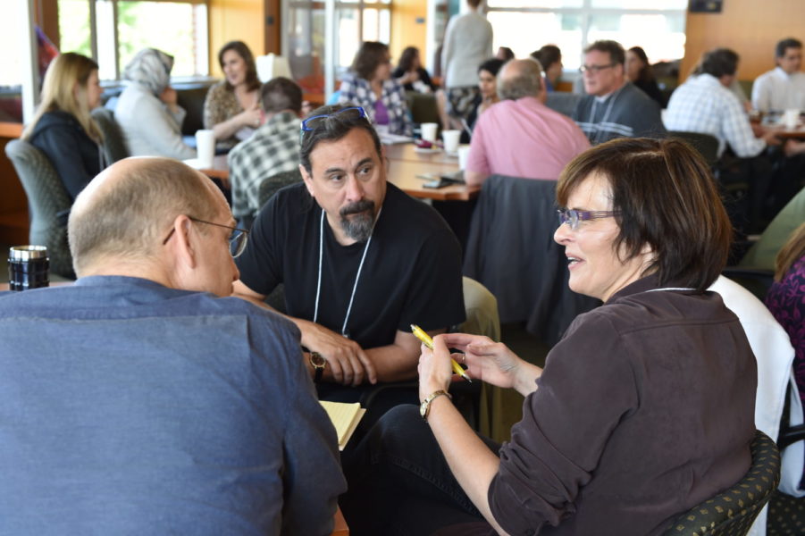 Faculty discussing assignment design