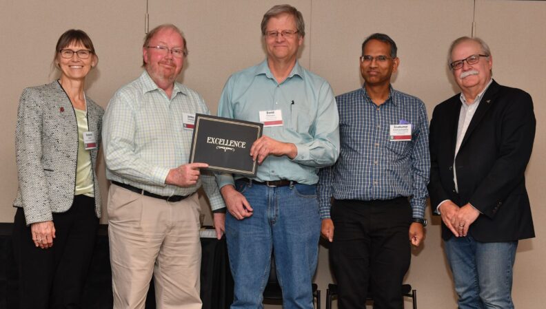 Interim Provost Bryan Slinker and ATL Director Kimberly Green presenting a certificate to Chemical Engineering.