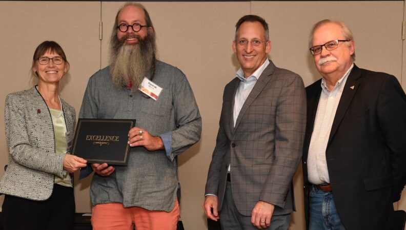 Interim Provost Bryan Slinker and ATL Director Kimberly Green presenting a certificate to Fine Arts.