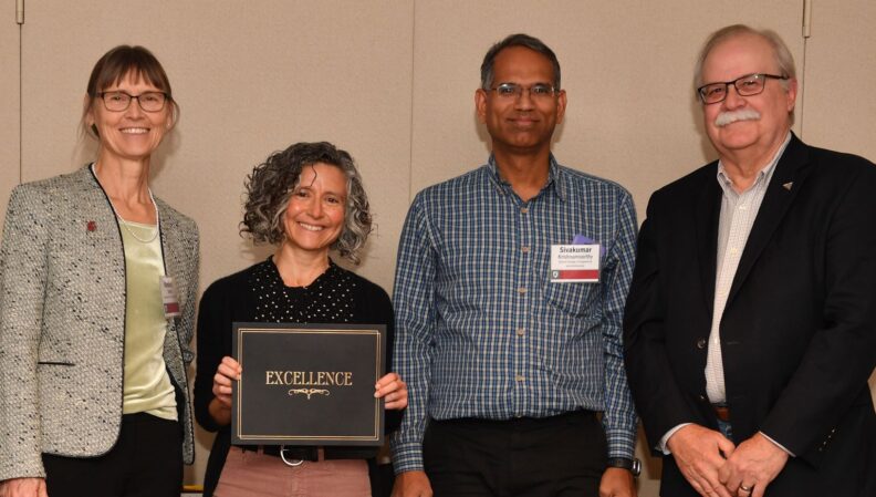 Interim Provost Bryan Slinker and ATL Director Kimberly Green presenting a certificate to Landscape Architecture.
