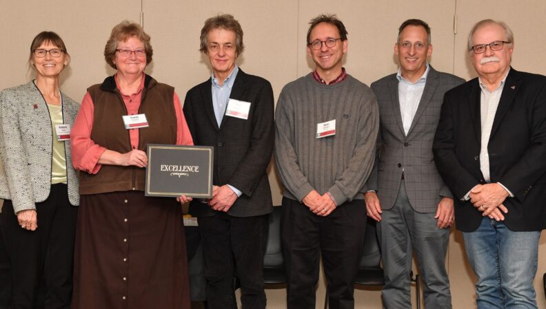 Interim Provost Bryan Slinker and ATL Director Kimberly Green presenting a certificate to Math.