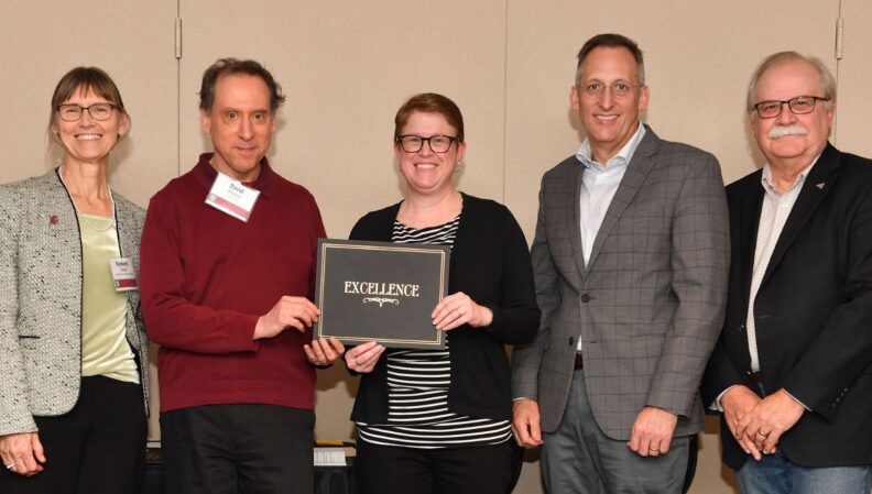 Interim Provost Bryan Slinker and ATL Director Kimberly Green presenting a certificate to Psychology.