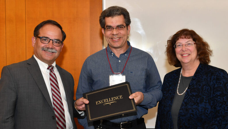Provost Dan Bernardo and Vice Provost Erica Austin presenting a certificate to Agricultural & Food Systems / Integrated Plant Sciences.