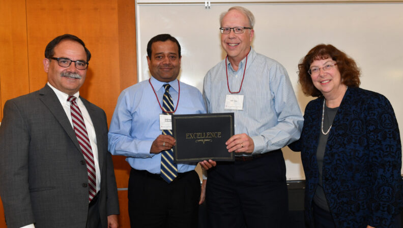 Provost Dan Bernardo and Vice Provost Erica Austin presenting a certificate to Civil Engineering.
