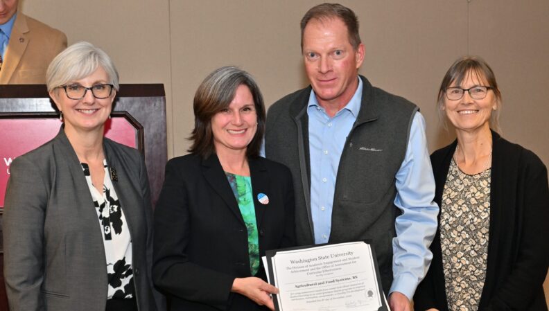 Provost Elizabeth Chilton and ACE Director Kimberly Green presenting a certificate to the Agricultural and Food Systems, BS.