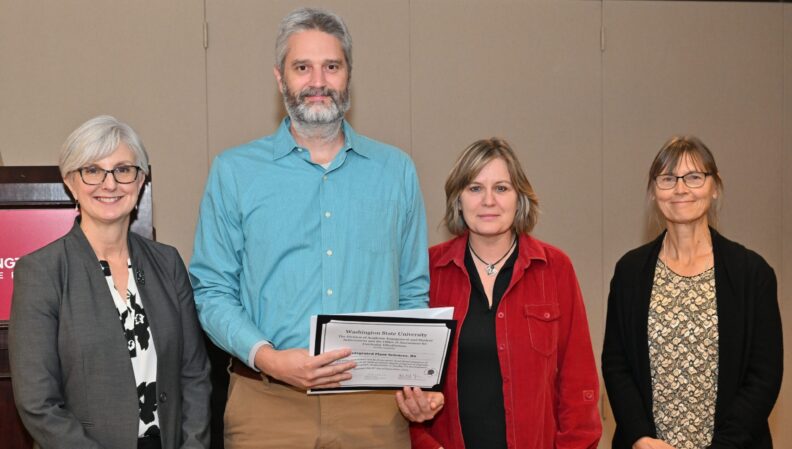 Provost Elizabeth Chilton and ACE Director Kimberly Green presenting a certificate to the Integrated Plant Sciences, BS.