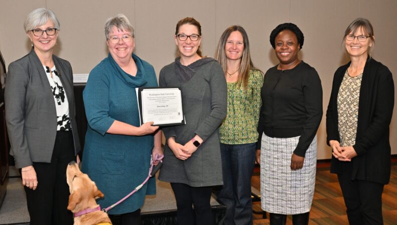 Provost Elizabeth Chilton and ACE Director Kimberly Green presenting a certificate to the Kinesiology, BS.