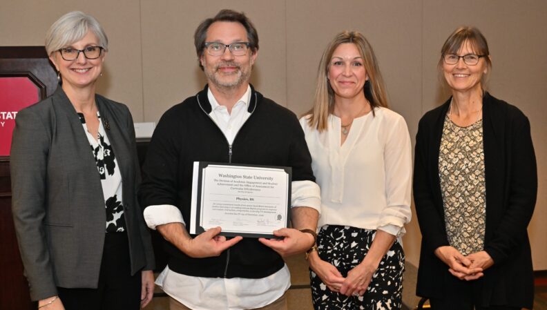 Provost Elizabeth Chilton and ACE Director Kimberly Green presenting a certificate to the Physics, BS.