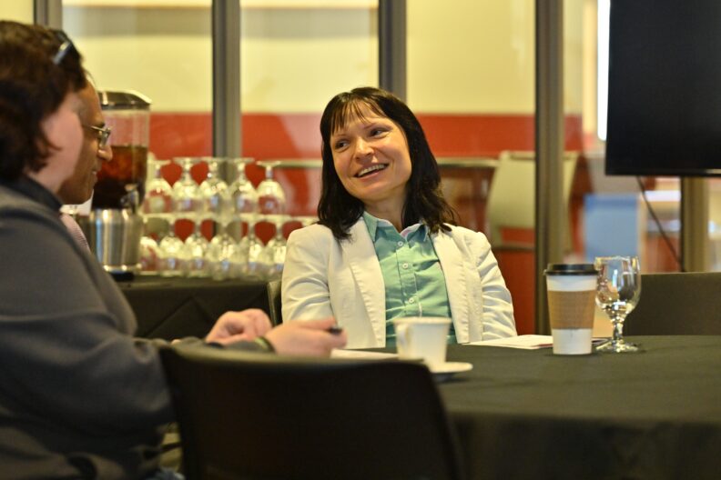 Attendees talking at 2024 Celebration of Assessment Excellence