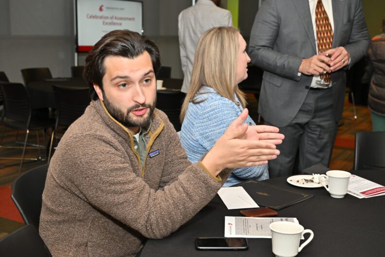 Attendees talking at 2024 Celebration of Assessment Excellence