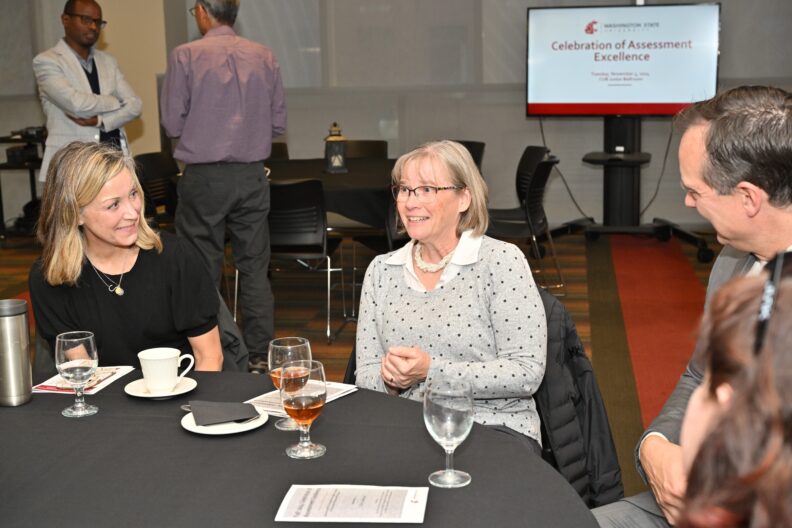 Attendees talking at 2024 Celebration of Assessment Excellence