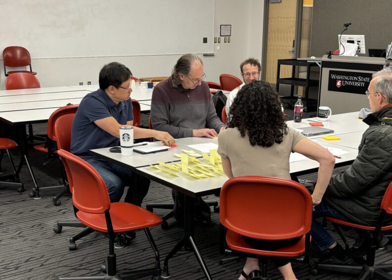 Physics faculty collaborating at Spring 2025 retreat