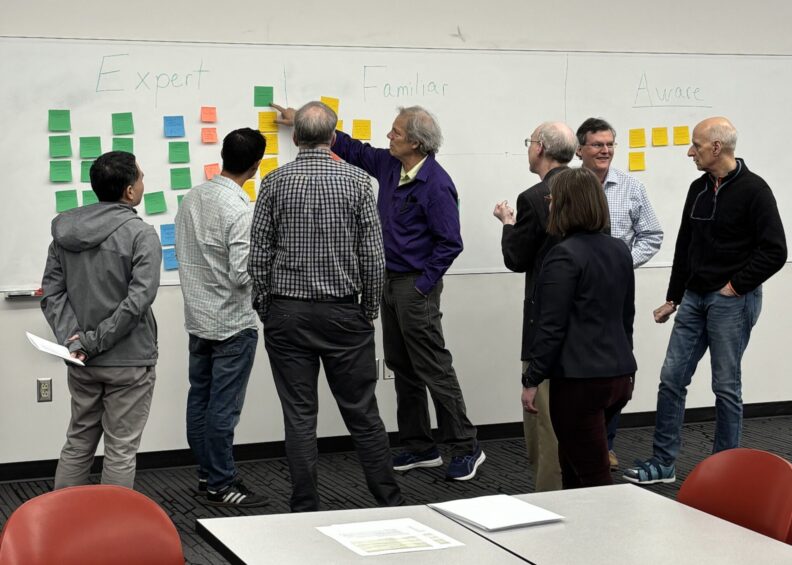 Physics faculty collaborating at Spring 2025 retreat