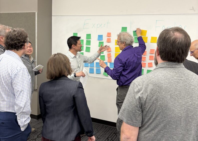 Physics faculty collaborating at Spring 2025 retreat