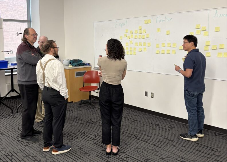 Physics faculty collaborating at Spring 2025 retreat