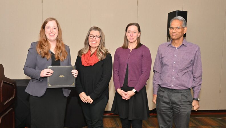 ACE Director Lindsey Brown presenting a certificate to the Interior Design, BA.