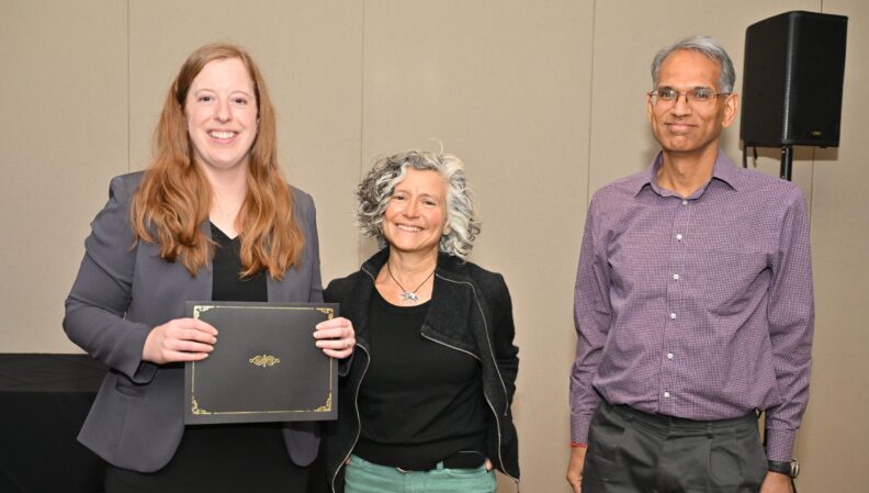 ACE Director Lindsey Brown presenting a certificate to the Landscape Architecture, BLA.