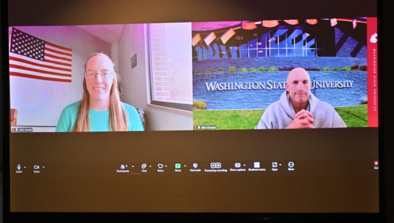 ACE Director Lindsey Brown presenting a certificate to the Nutrition & Exercise Physiology, BS.