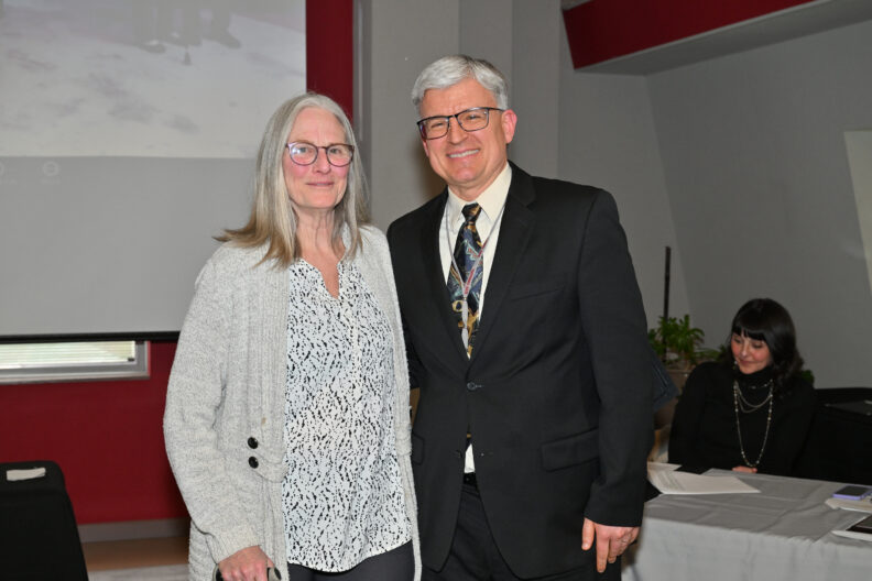 Lisa Johnson-Shull and Corey Johnson smile at the camera.