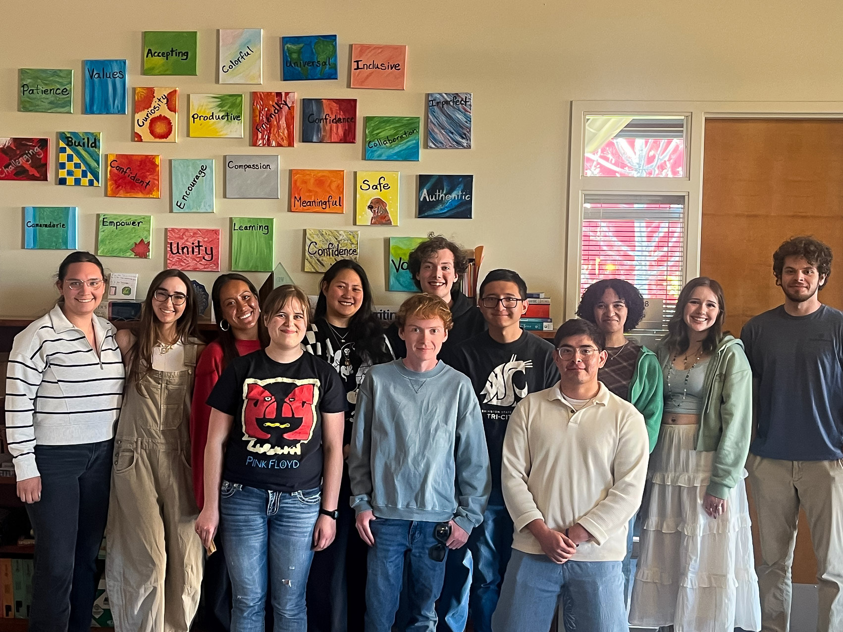 Writing Center Consultants pose for group photo in the writing center.