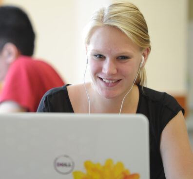 A student working on a laptop computer.