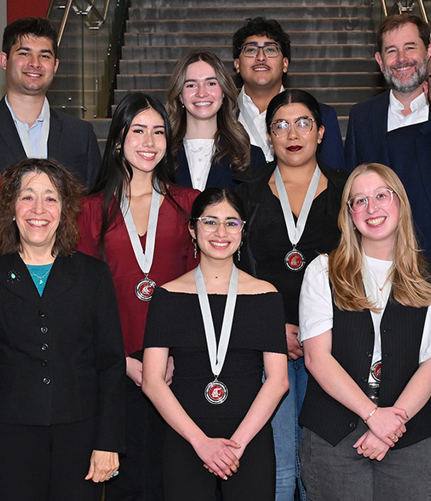 Distinguished Scholarship recipients pose together for a group photo at the annual Distinguished Scholars celebration. They are joined by Provost T. Chris Riley-Tillman, Vice Provost Bill Davis, Assistant Vice Provost Mary Sánchez Lanier, and Director April Seehafer.