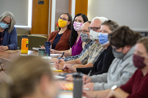 Core to Career faculty working together at table.