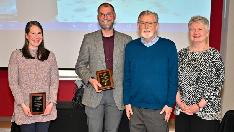Hillary Mellinger and Jesse Spohnholz hold their award up to the camera as they celebrate with Dick Law and Karen Weathermon during the 2025 DAESA Awards Ceremony.