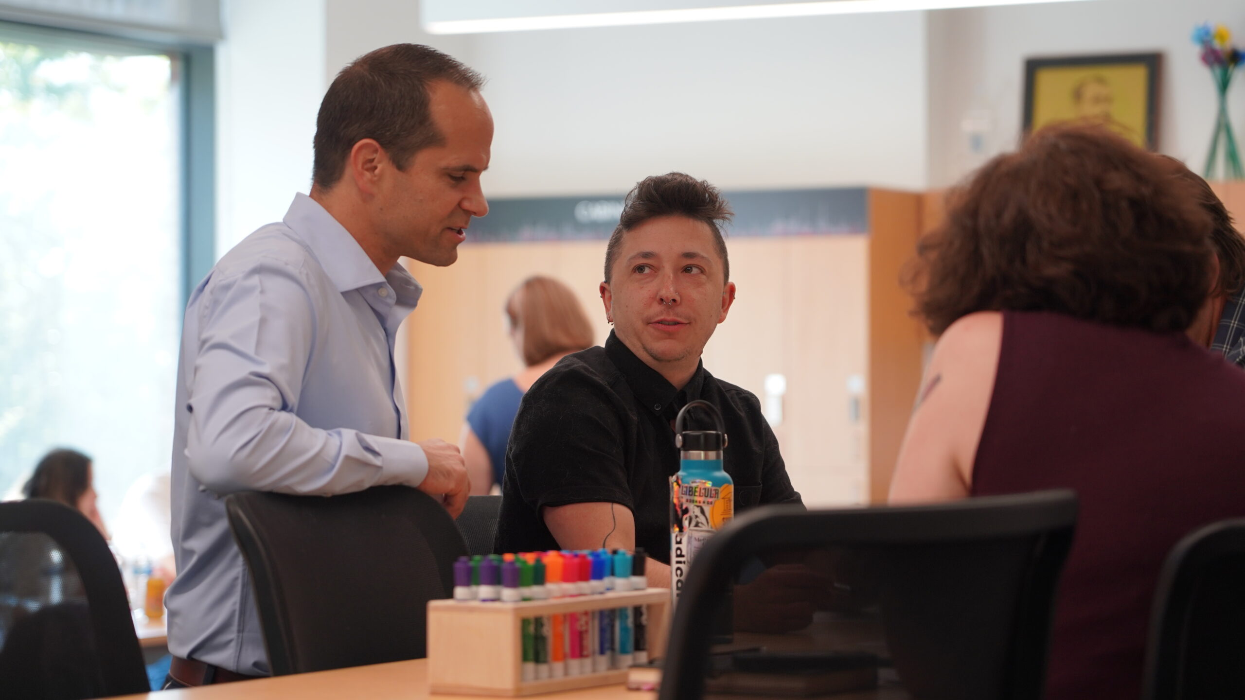A Core to Career faculty has a discussion with the speaker at a workshop session of a fall 2023 planning session.