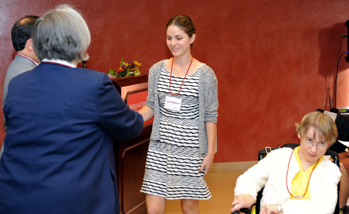 Kacie McPartland shakes hands with Dr. Mary Wack.