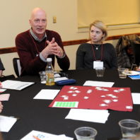 M. Grant Norton speaking to the students at his table.
