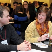 Shelley Pressley talks to a student at the freshman scholars progression 2018 event
