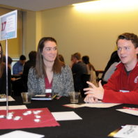 Two students listen to Garret Kalt speaking at the Freshman Scholars Progression 2018 event