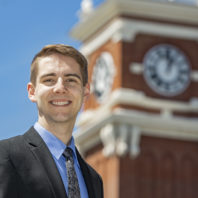 Fulbright 2020 recipient Thomas LeClair standing outside of Bryan Hall on the WSU Pullman campus.