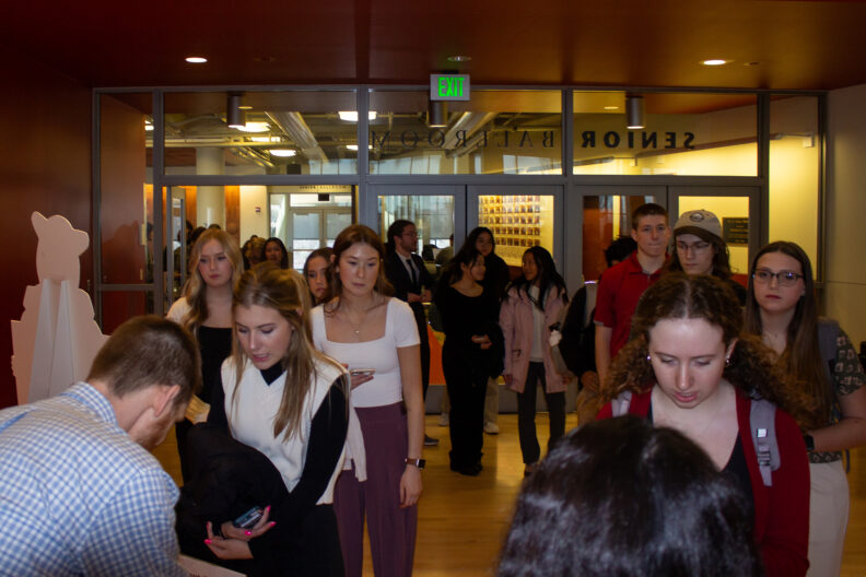 Full resolution of students entering the CUB Senior Ballroom.