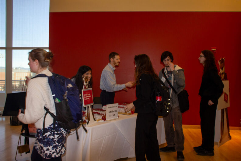 Full resolution of students checking in at Progression 2024.