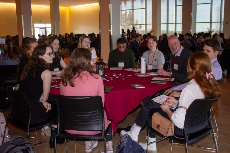 Full resolution of Grant Norton delivering a table talk.