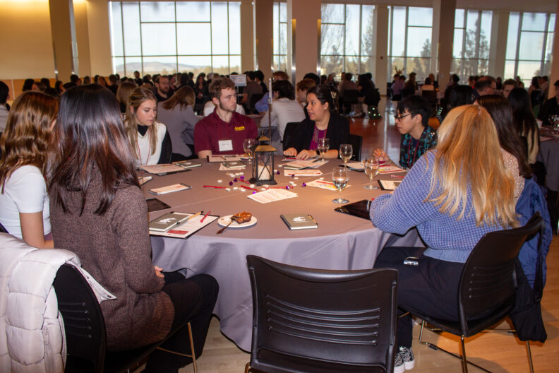 Full resolution of Amanda Morgan leading a table talk.