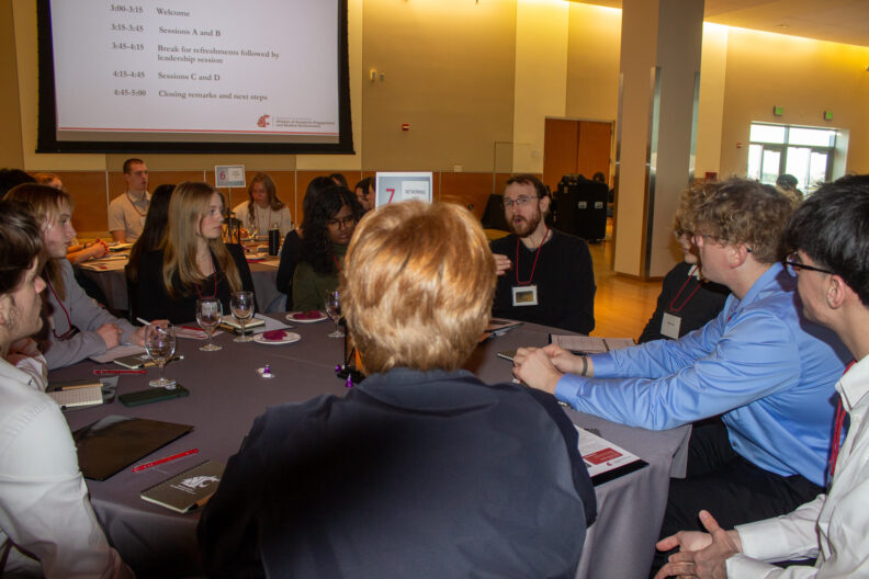 Full resolution of Harrison Hughes leading a table talk.