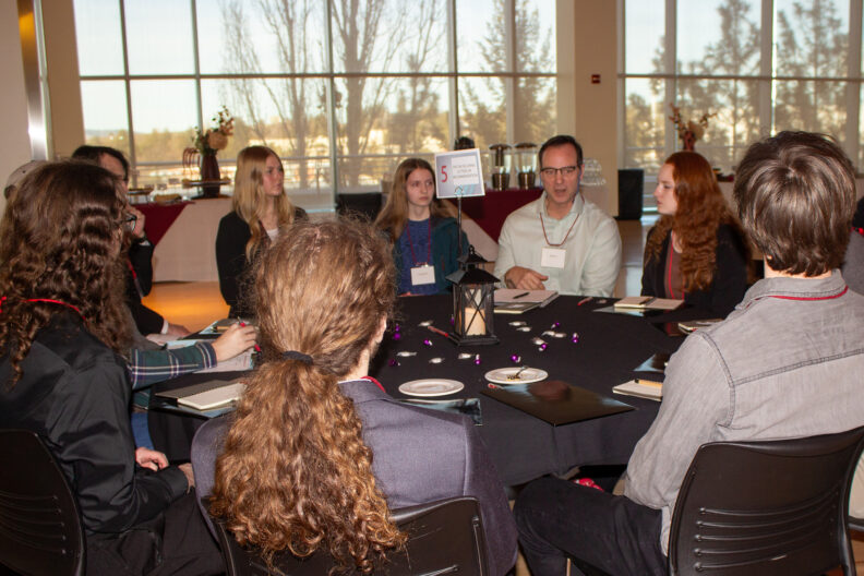 Full resolution of Bill Davis leading a table talk.