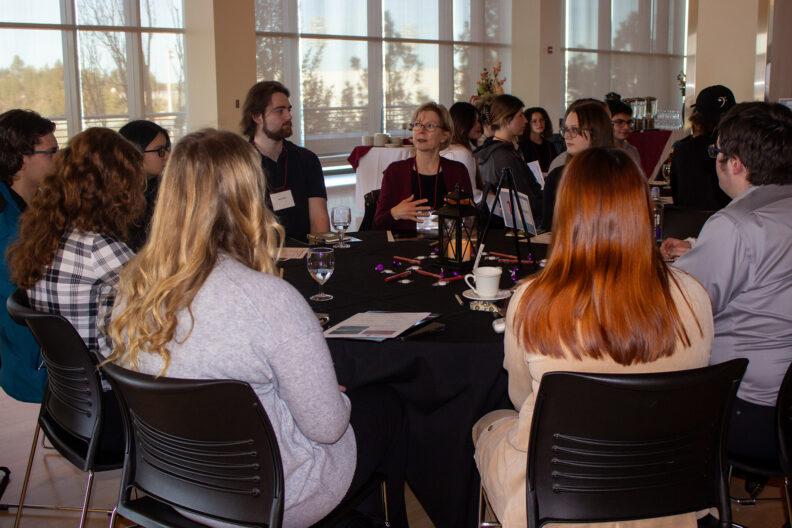 Full resolution of Robin Bond hosting a table talk.