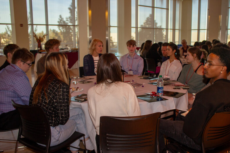 Full resolution of Marie Mayes chairing a table talk.