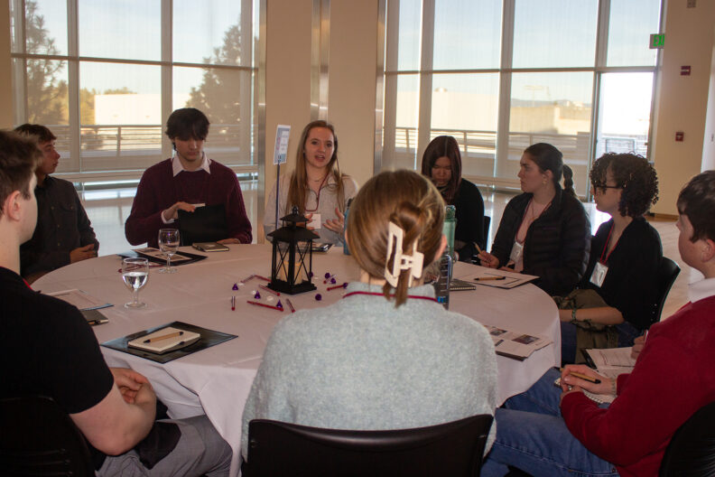 Full resolution of Matteya Proctor leading a table talk.