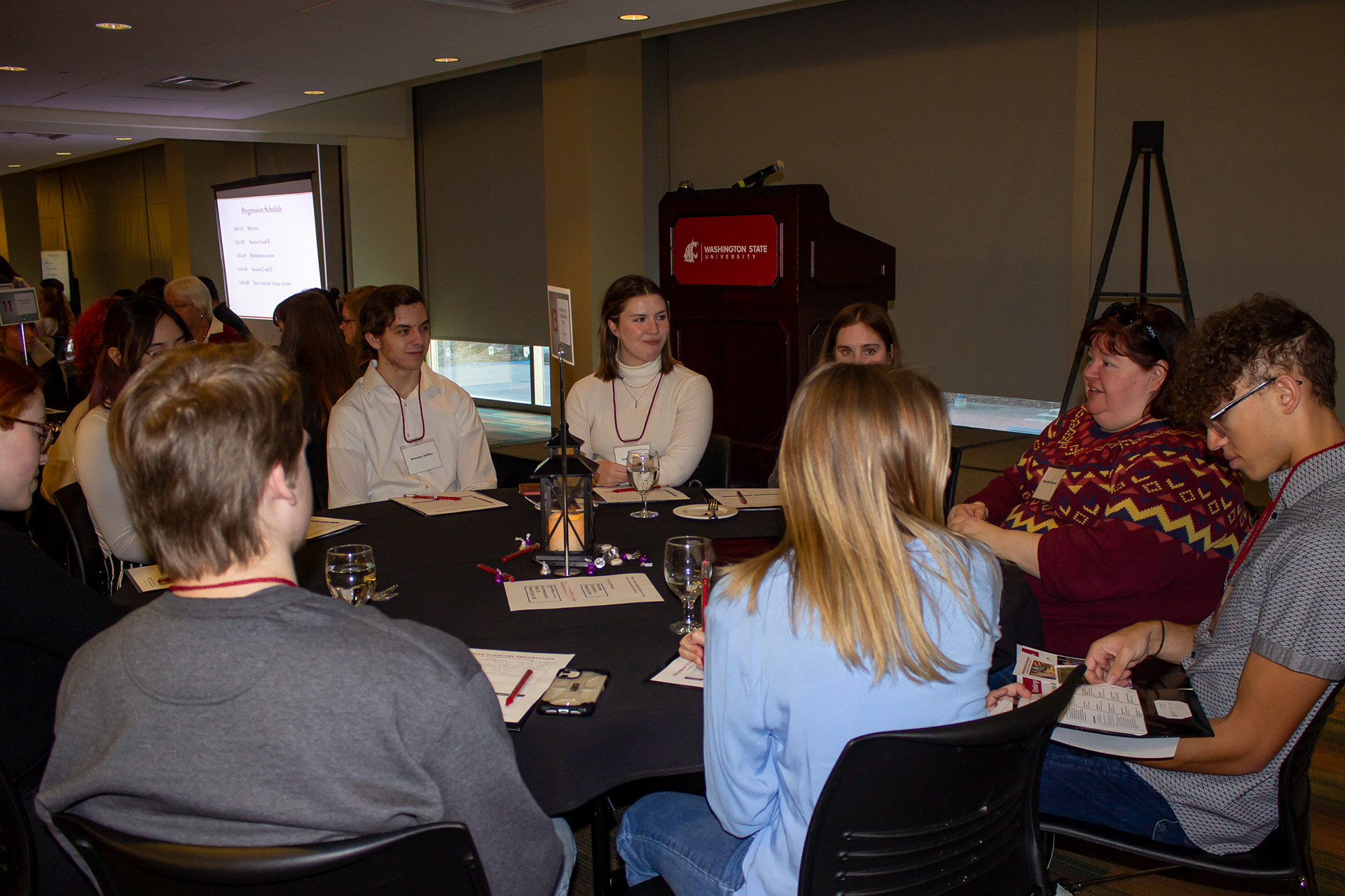 Students participate in a table discussion with WSU faculty member Samantha Gizerian, Associate Professor of Integrative Physiology and Neuroscience, at the 2023 WSU Scholars Progression.