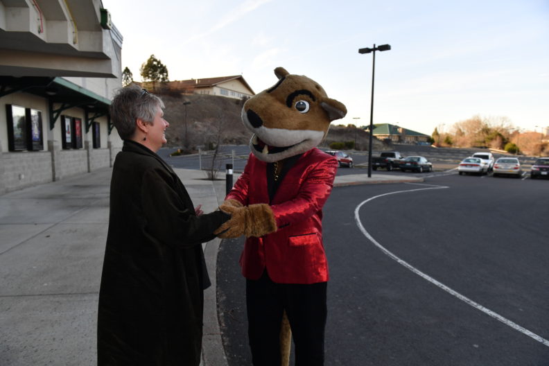 WSU's Butch mascot shakes the hand of Common Reading Program Director Karen Weathermon. Select to view full resolution version.