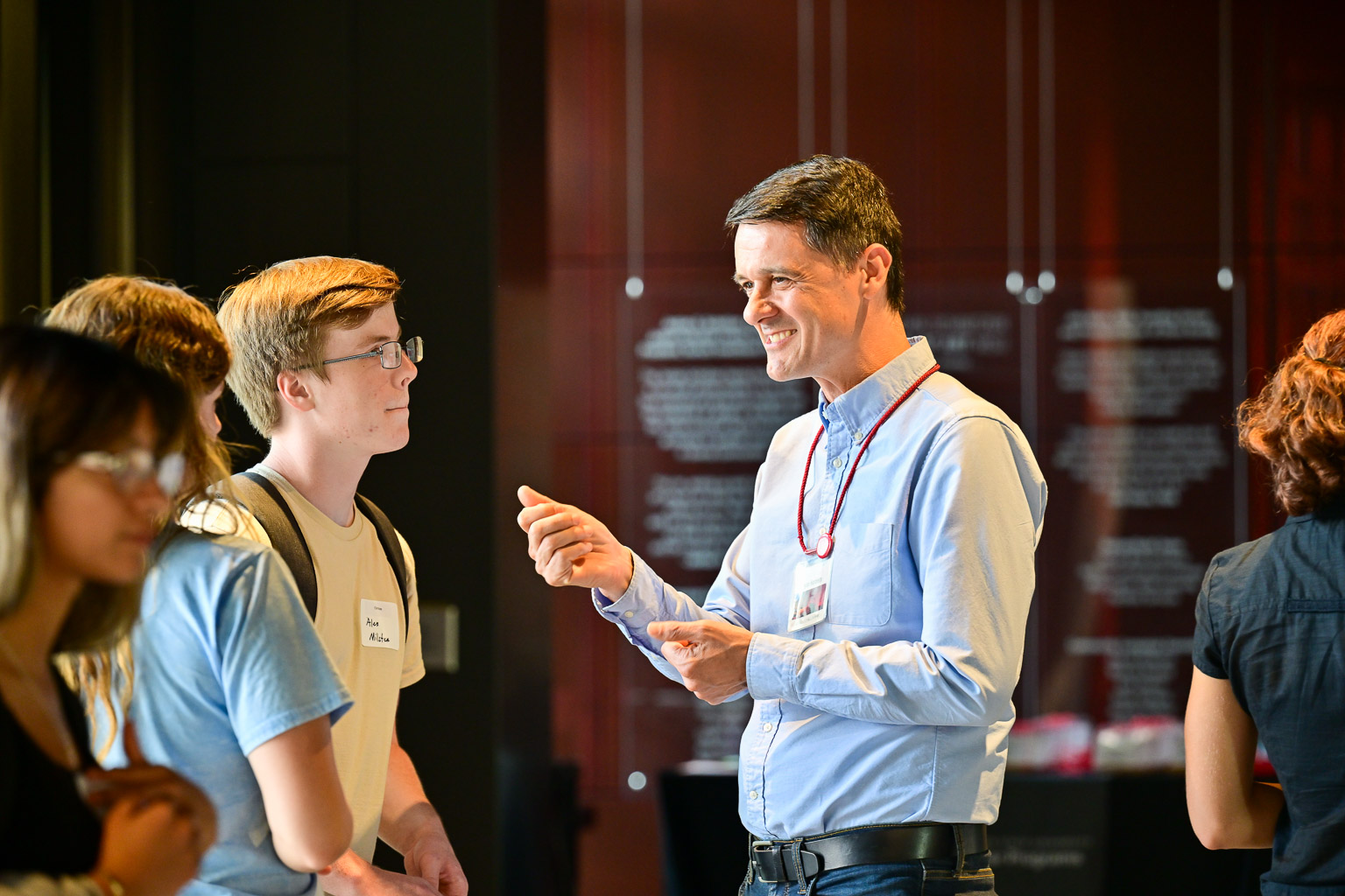 Students are greeted by the museum director as they enter the “Fall 2025 First-Year Programs Evening at the Museum” event.