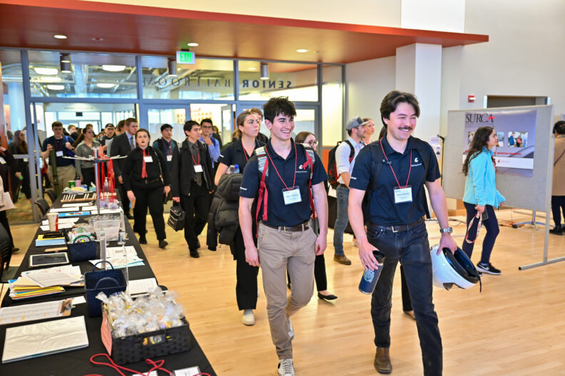 Undergraduate researchers walk into the CUB Senior Ballroom as SURCA 2023 begins.